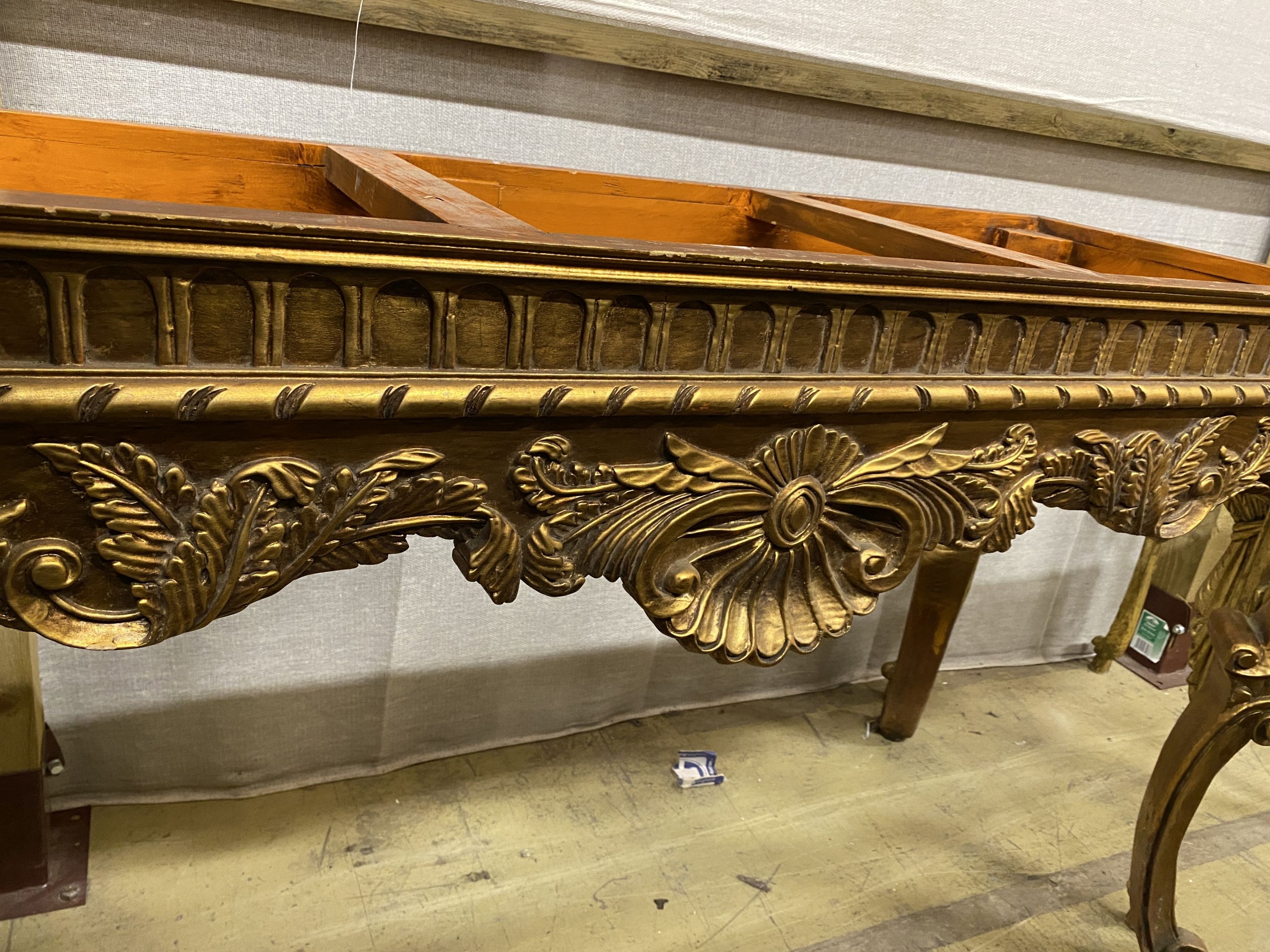 Two 18th century style giltwood table bases (lacking marble tops), larger width 127cm, depth 47cm, height 79cm